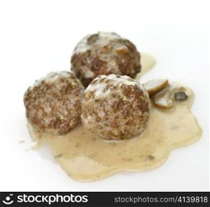 meatballs with mushrooms and gravy, close up