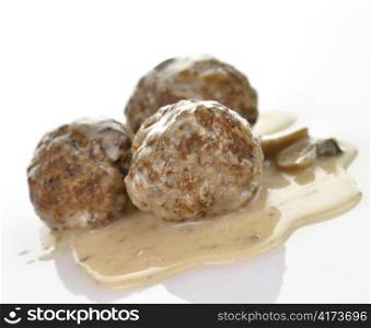 meatballs with mushrooms and gravy, close up