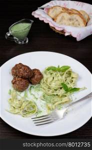 Meatballs with pasta sauce avocado, parmesan and basil