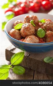 meatballs with tomato sauce in blue bowl