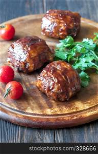 Meatballs wrapped in bacon on the wooden board