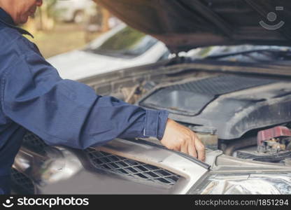 Mechanic car service auto garage in automotive mobile center. Technician workshop repair engine motor vehicles service mechanical engineering business. Automobile mechanic hands car repairs technic