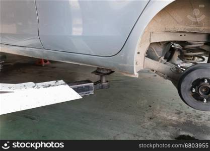 mechanic changing a wheel of a modern car, tire replacement service