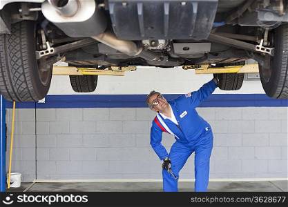 Mechanic checking the car at automobile repair shop