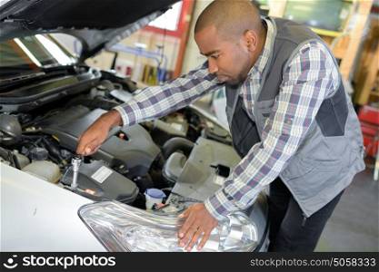 mechanic doing vehicle check-up