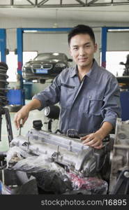 Mechanic Fixing Car Engine