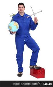 Mechanic holding a globe and a cross wheel spanner