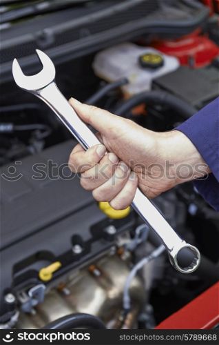 Mechanic Holding Spanner Fixing Car Engine