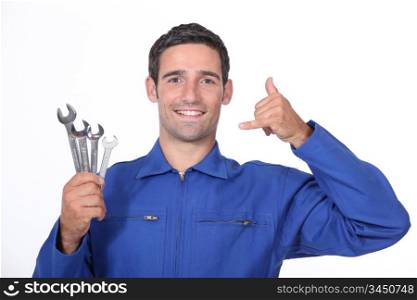Mechanic making telephone with hand