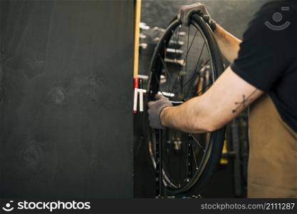 mechanic repairing bicycle_2