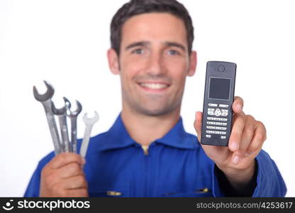 Mechanic showing mobile phone