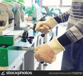 Mechanic working on a machine at workroom