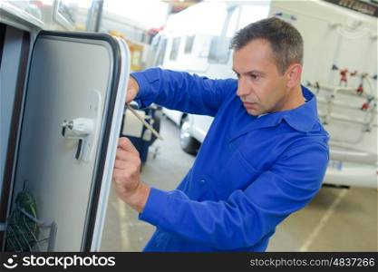 Mechanic working on camper van