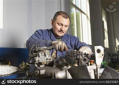 Mechanic Working on Motor