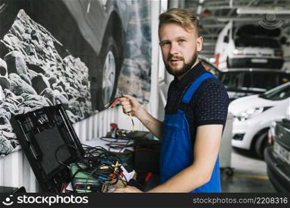 mechanic working with wires workshop