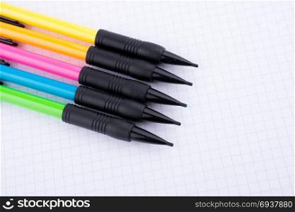 mechanical pencisl of various color on white background