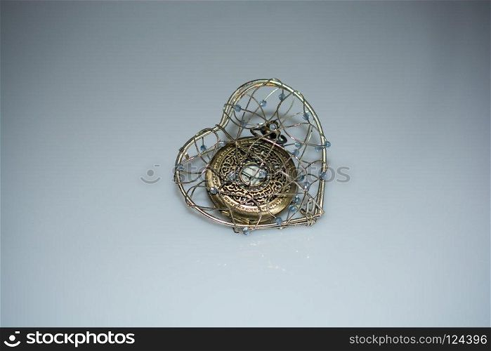 Mechanical  retro styled pocket watch  in a heart cage