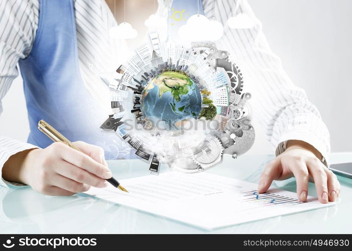 Mechanisms of world organization. Close view of businesswoman writing with pen. Elements of this image are furnished by NASA