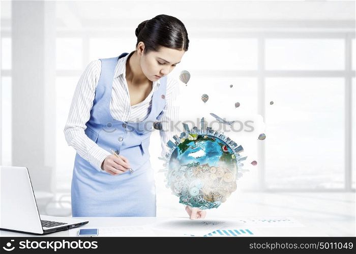 Mechanisms of world organization. Young smiling businesswoman working in office. Elements of this image are furnished by NASA