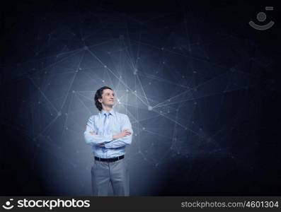 Media connection concept. Confident businessman with arms crossed on chest on background of connection concept