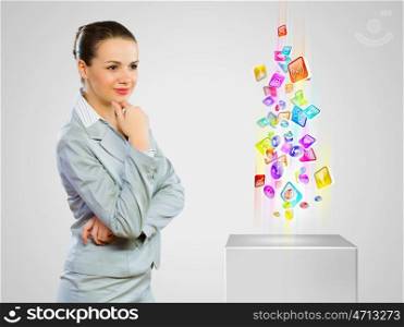 Media icons. Image of businesswoman looking at media icons. Modern technologies
