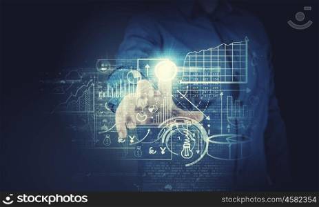 Media interface. Businessman hand pushing business graph on touch screen interface
