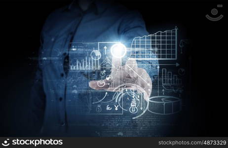 Media interface. Businessman hand pushing business graph on touch screen interface