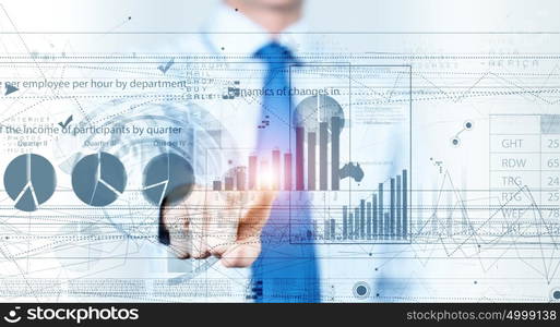 Media interface. Businessman hand pushing business graph on touch screen interface