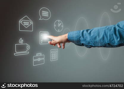 Media interface. Hand of businessman pressing button on virtual screen