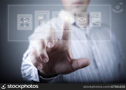 Media interface. Hand of businessman pressing button on virtual screen