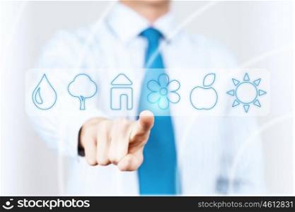 Media interface. Hand of businessman pressing icons on virtual screen