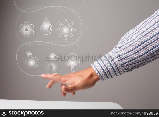 Media interface. Hand of businessman pressing icons on virtual screen