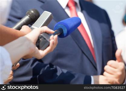 Media interview with business person, politician or spokesman