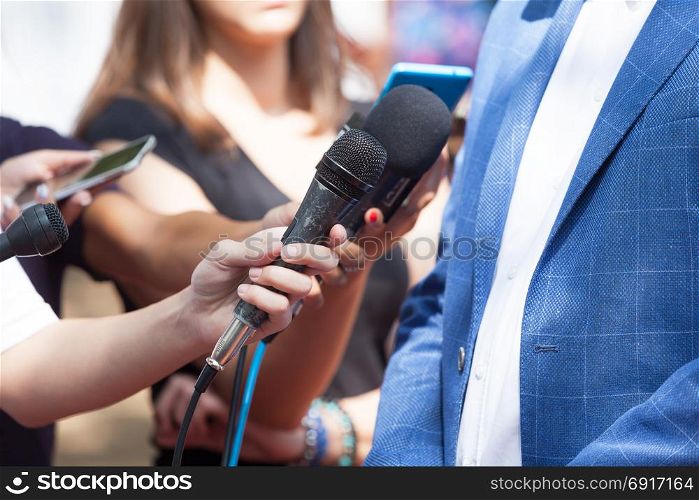 Media or press interview with business person or politician