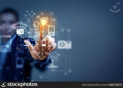 Media technologies. Close up of businessman touching icon of media screen