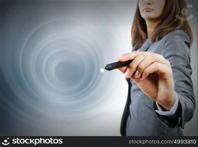 Media technologies. Close up of businesswoman drawing on media screen with pen