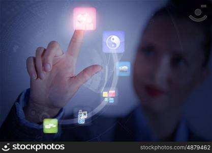 Media technologies. Close up of businesswoman touching icon of media screen