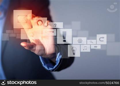 Media technologies. Close up of businesswoman touching icon of media screen