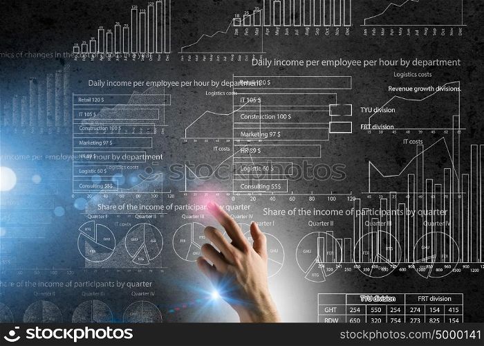 Media technologies for business. Businessman hand pushing business graph on touch screen interface