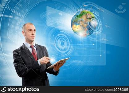 Media technologies. Image of businessman with tablet pc. Elements of this image are furnished by NASA