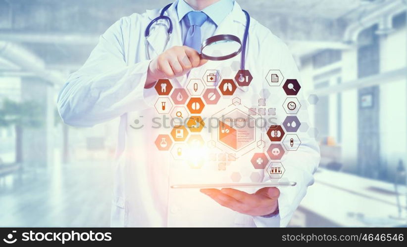 Media technologies in use. Medicine doctor working with modern digital tablet pc interface