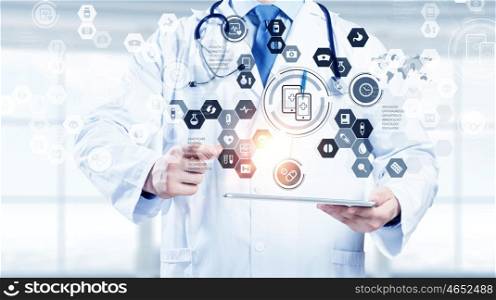 Media technologies in use. Medicine doctor working with modern digital tablet pc interface