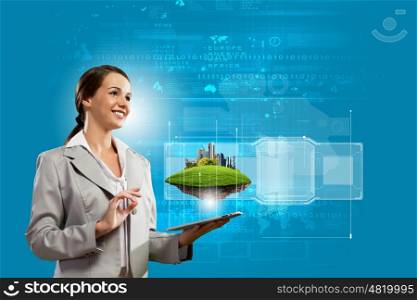 Media technologies. Young businesswoman with tablet pc in hands. Ecology concept
