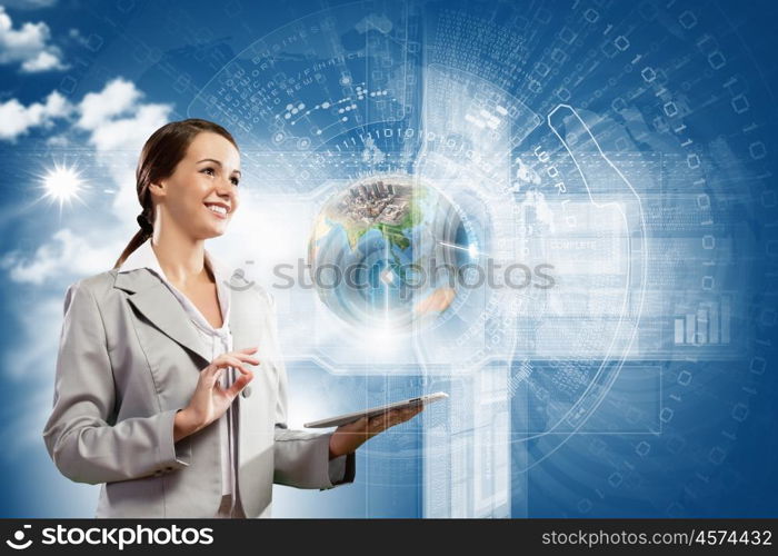 Media technologies. Young businesswoman with tablet pc in hands. Globalization concept. Elements of this image are furnished by NASA