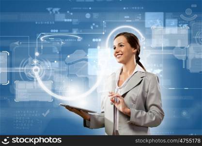 Media technologies. Young businesswoman with tablet pc in hands. Globalization concept