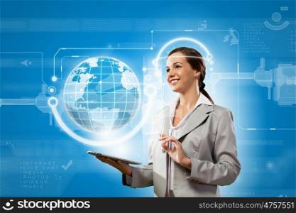 Media technologies. Young businesswoman with tablet pc in hands. Globalization concept