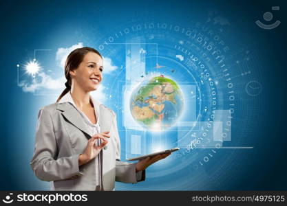 Media technologies. Young businesswoman with tablet pc in hands. Globalization concept. Elements of this image are furnished by NASA