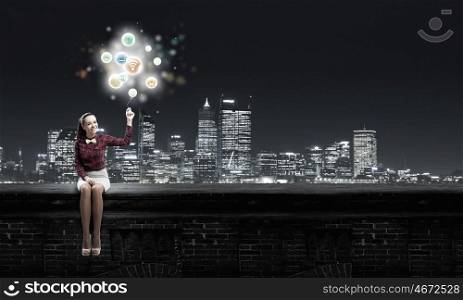 Media technologies. Young pretty woman with media icons balloon in hand