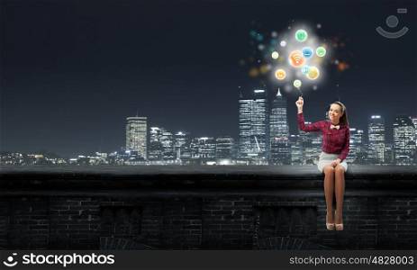 Media technologies. Young pretty woman with media icons balloon in hand