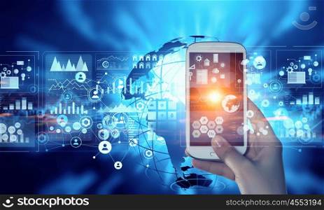 Media user interface. Hand holding smartphone on user display background
